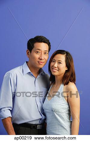 Couple smiling at camera, portrait View Large Photo Image Stock Photo - Couple smiling at camera, portrait. Fotosearch