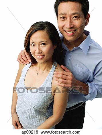 Stock Photo - Couple smiling at camera. Fotosearch