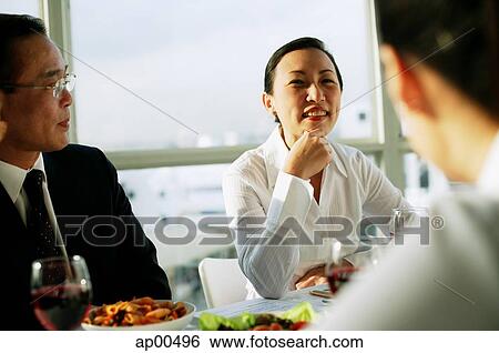 Executives having lunch View Large Photo Image Stock Photograph - Executives having lunch. Fotosearch