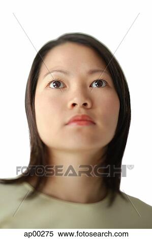 Stock Photography - Head shot, young woman looking away. Fotosearch