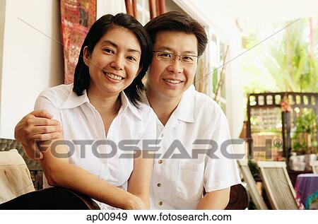 Husband and wife looking at camera, portrait View Large Photo Image Stock Photo - Husband and wife looking at camera, portrait. Fotosearch