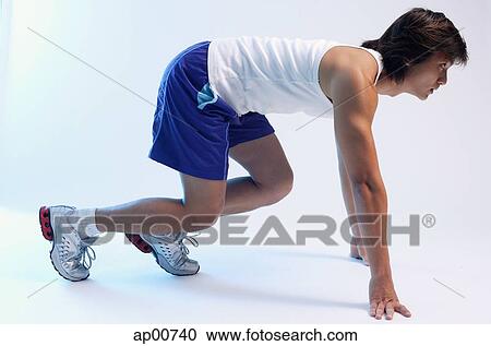 Man at starting position, waiting for signal, side view View Large Photo Image Stock Image - Man at starting position, waiting for signal, side view. Fotosearch