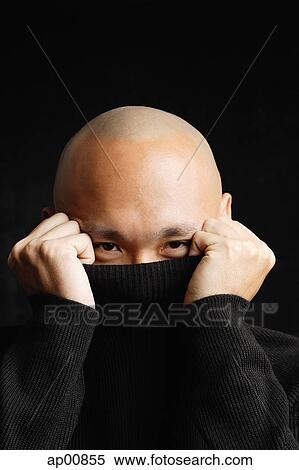 Man hiding behind turtleneck, looking at camera View Large Photo Image Stock Photography - Man hiding behind turtleneck, looking at camera. Fotosearch