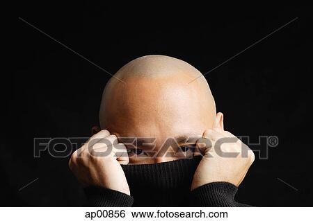 Man hiding behind turtleneck, obscured face View Large Photo Image Stock Photograph - Man hiding behind turtleneck, obscured face. Fotosearch
