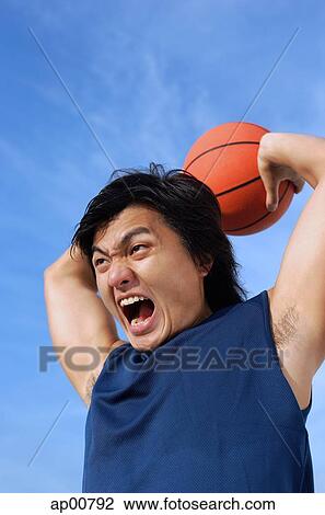 Man holding basketball, shouting View Large Photo Image Stock Image - Man holding basketball, shouting. Fotosearch