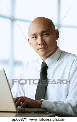 Man in front of computer, looking at camera, portrait View Large Photo Image Stock Image - Man in front of computer, looking at camera, portrait. Fotosearch