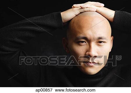 Man looking at camera, hands on head View Large Photo Image Stock Photo - Man looking at camera, hands on head. Fotosearch
