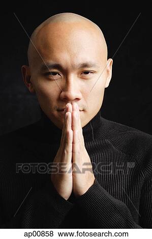 Man looking at camera, hands together View Large Photo Image Stock Photo - Man looking at camera, hands together. Fotosearch