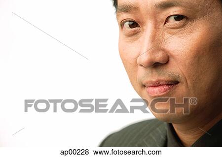Stock Photo - Man looking at camera, portrait. Fotosearch