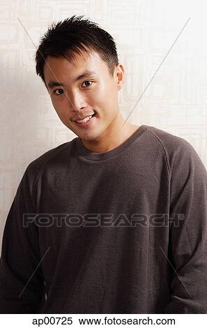 Stock Photography - Man looking at camera, portrait. Fotosearch