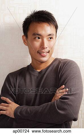 Man looking away, arms crossed, portrait View Large Photo Image Picture - Man looking away, arms crossed, portrait. Fotosearch