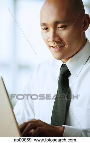 Man using computer View Large Photo Image Stock Photo - Man using computer. Fotosearch