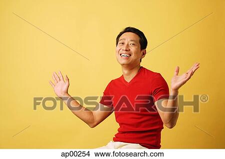 Picture - Man with arms outstretched, smiling. Fotosearch