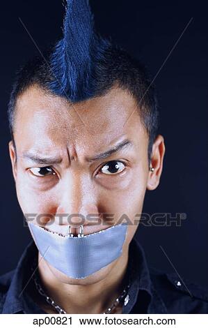 Man with mohawk, mouth taped shut, looking at camera, eyebrow raised View Large Photo Image Stock Image - Man with mohawk, mouth taped shut, looking at camera, eyebrow raised. Fotosearch