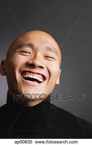 Man with shaved head, laughing View Large Photo Image Stock Photography - Man with shaved head, laughing. Fotosearch
