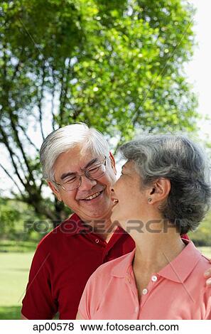 Mature couple, looking at each other, smiling View Large Photo Image Stock Photo - Mature couple, looking at each other, smiling. Fotosearch