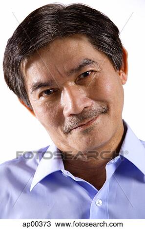 Stock Image - Mature man looking at camera, portrait. Fotosearch