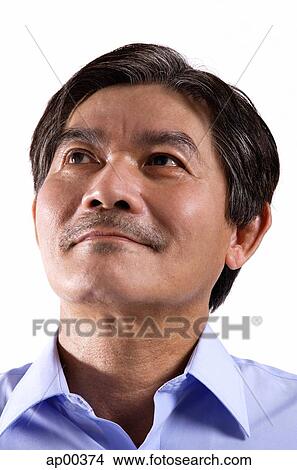 Mature man looking away, portrait View Large Photo Image Picture - Mature man looking away, portrait. Fotosearch