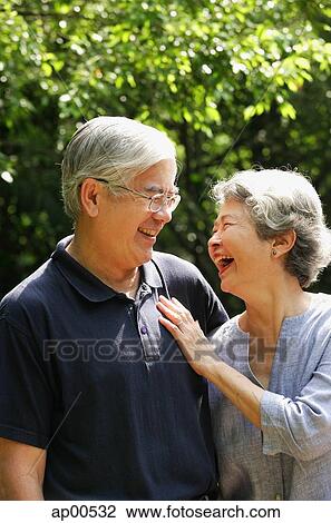 Senior couple facing each other, smiling View Large Photo Image Stock Image - Senior couple facing each other, smiling. Fotosearch