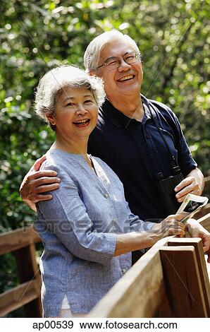 Stock Photo - Senior couple side by side, looking at camera. Fotosearch