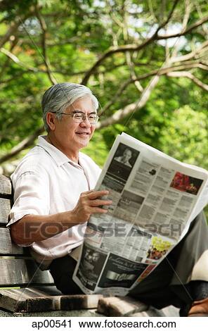 Senior man reading newspaper View Large Photo Image Stock Image - Senior man reading newspaper. Fotosearch