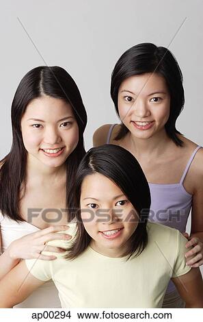 Three young women, portrait View Large Photo Image Picture - Three young women, portrait. Fotosearch