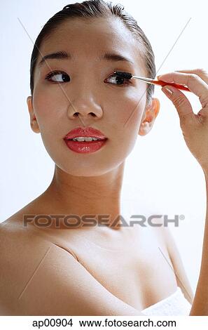 Woman applying eye shadow View Large Photo Image Picture - Woman applying eye shadow. Fotosearch