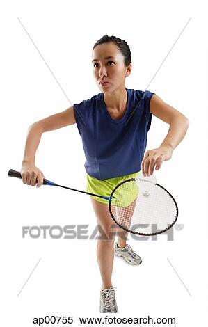 Woman holding badminton racket and shuttlecock View Large Photo Image Stock Photography - Woman holding badminton racket and shuttlecock. Fotosearch
