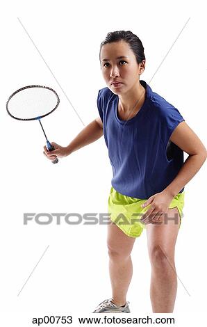 Woman holding badminton racket, bending forward View Large Photo Image Stock Image - Woman holding badminton racket, bending forward. Fotosearch