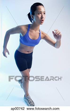 Woman in running position View Large Photo Image Stock Image - Woman in running position. Fotosearch