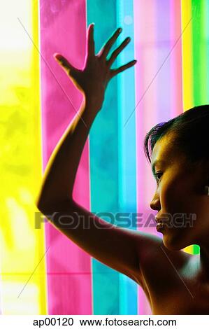 Woman leaning hand against coloured glass View Large Photo Image Stock Image - Woman leaning hand against coloured glass. Fotosearch