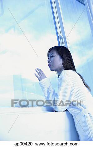 Woman leaning on ledge, looking through window View Large Photo Image Stock Image - Woman leaning on ledge, looking through window. Fotosearch