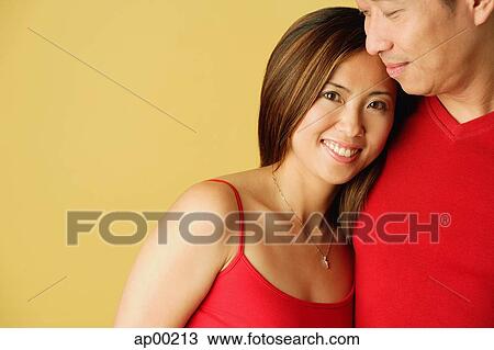 Woman leaning on man, smiling at camera View Large Photo Image Stock Image - Woman leaning on man, smiling at camera. Fotosearch