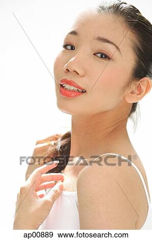 Woman looking at camera, side view View Large Photo Image Stock Photo - Woman looking at camera, side view. Fotosearch