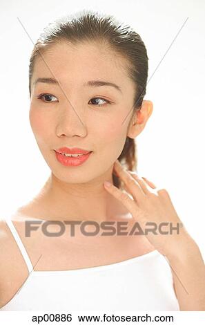 Woman looking away, hand on neck View Large Photo Image Stock Photograph - Woman looking away, hand on neck. Fotosearch