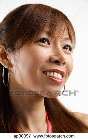 Stock Photo - Woman looking away, headshot. Fotosearch