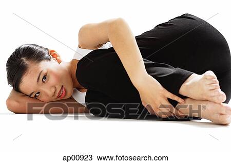 Woman lying on side, hugging knee, looking at camera View Large Photo Image Stock Image - Woman lying on side, hugging knee, looking at camera. Fotosearch