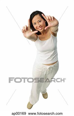 Woman making hand sign at camera View Large Photo Image Stock Photo - Woman making hand sign at camera. Fotosearch