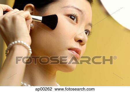 Woman putting on blusher View Large Photo Image Stock Image - Woman putting on blusher. Fotosearch