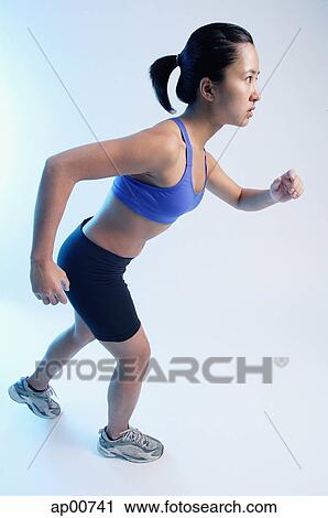 Stock Image - Woman running. Fotosearch