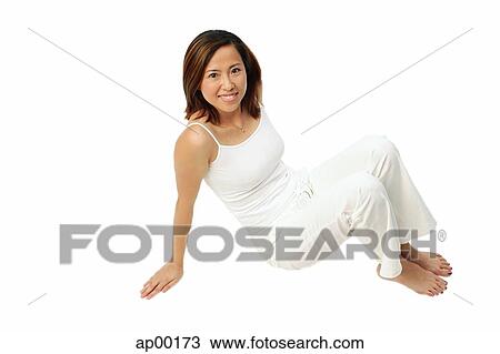 Woman sitting, looking up at camera View Large Photo Image Stock Image - Woman sitting, looking up at camera. Fotosearch
