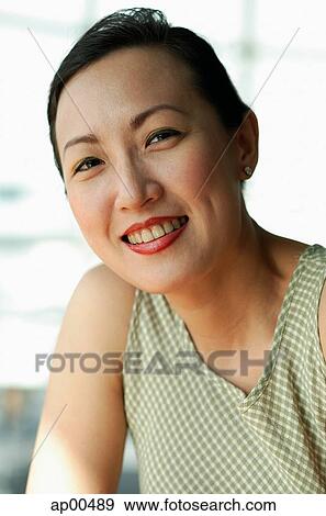 Woman smiling at camera View Large Photo Image Stock Photo - Woman smiling at camera. Fotosearch
