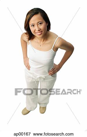 Woman smiling up at camera, hands on hips View Large Photo Image Stock Photo - Woman smiling up at camera, hands on hips. Fotosearch