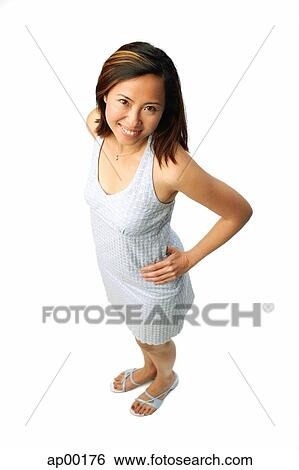 Stock Photograph - Woman standing with hands on hips. Fotosearch