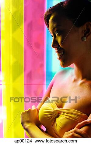 Woman with arms crossed, smiling, looking away View Large Photo Image Picture - Woman with arms crossed, smiling, looking away. Fotosearch