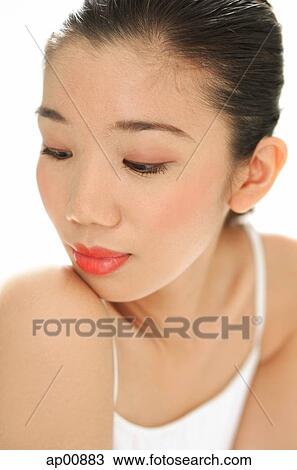 Woman with downward glance, head shot View Large Photo Image Stock Image - Woman with downward glance, head shot. Fotosearch