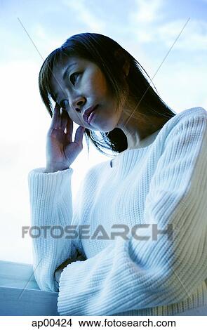 Woman with hand on head View Large Photo Image Picture - Woman with hand on head. Fotosearch