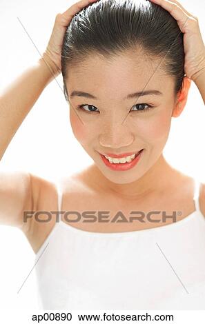 Woman with hands on head View Large Photo Image Stock Image - Woman with hands on head. Fotosearch