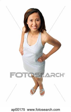 Woman with hands on hips, looking up at camera View Large Photo Image Stock Photography - Woman with hands on hips, looking up at camera. Fotosearch