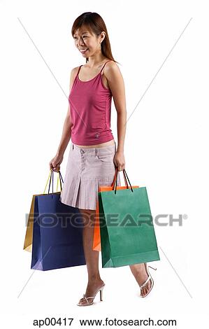 Woman with shopping bags, portrait View Large Photo Image Stock Photo - Woman with shopping bags, portrait. Fotosearch